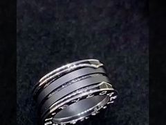 18K Gold Luxury Brand Jewelry Ring With Two 18 Kt White Gold Loops And A Black Ceramic Spiral